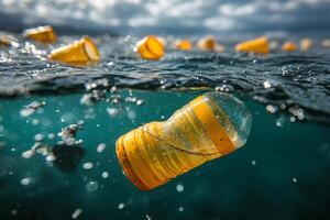 Plastic bottles and cups floating in polluted ocean water photo