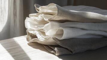 Linen fabric stacked neatly in natural light photo