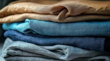 Linen fabric stacked in various colors and textures photo