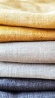 Linen fabric in various vibrant colors stacked neatly photo