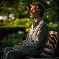 A man sitting on a bench photo