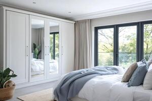 Modern bedroom interior design with mirrored sliding wardrobe and garden view photo