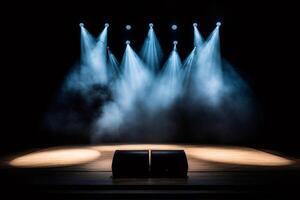 Stage lights illuminating empty stage with speakers and smoke effect photo