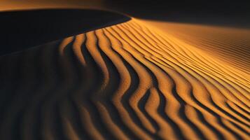 Intricate patterns on desert sand at sunset photo