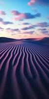 A desert with ripples and clouds in the sky photo
