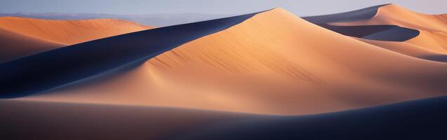 A desert landscape with sand dunes and mountains photo