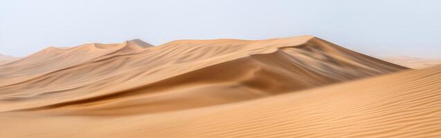 A desert with sand dunes and mountains photo
