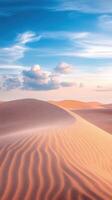 Sand dunes in the desert with blue sky and clouds photo