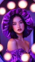 A woman in a purple dress and hat photo