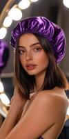Silk bonnet fashion statement with elegant makeup in warm lighting photo
