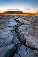 Cracked earth in the middle of a desert photo