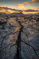 The lava flows in the middle of a desert at sunset photo