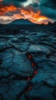 A lava flow at sunset with red and orange colors photo