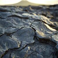 Cracked lava rock with a mountain in the background photo