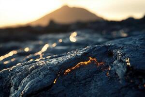 A lava flow on the ground with a mountain in the background photo