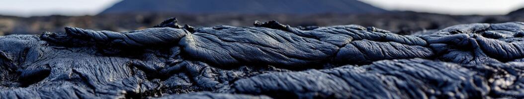 Lava flows create a dramatic landscape near an active volcano at sunset photo