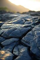Unique textures of hardened lava flow under the evening light photo