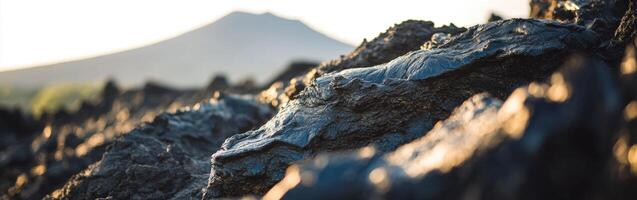 Volcanic landscape showcasing lava formations during sunset photo