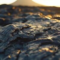 Dramatic close-up of volcanic rock during sunset near an active volcano photo