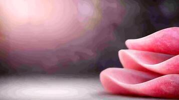 Delicate pink petals resting gracefully on a smooth surface, with a soft blurred background photo