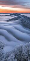 Breathtaking sunrise over misty mountains photo