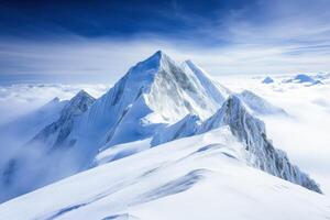 Snow-capped peaks under a blue sky photo