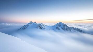 Stunning mountain peaks above the clouds photo