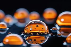 Orange and transparent bubbles creating abstract shapes on dark reflective surface photo
