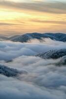 Mountain landscape blanketed in fog photo