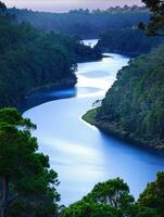 Serene river winding through lush hills photo