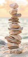 Balanced stones create a serene beach display photo