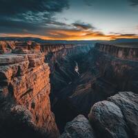 The sun sets over the grand canyon at sunset photo