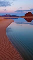 A sandy beach with water and sand photo