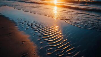 The sun is setting over the ocean and waves photo