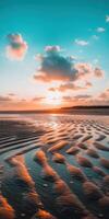 Sunset on the beach with waves and clouds photo