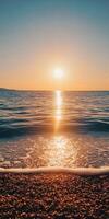 The sun setting over the ocean photo