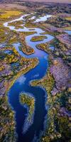 An aerial view of a river and marsh photo