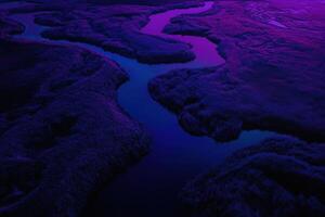 Purple sky over a river and marshland photo
