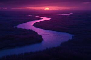 A river runs through a marsh at sunset photo