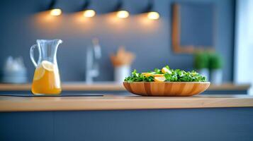 Fresh salad with citrus fruits in a modern kitchen, featuring a pitcher of lemonade and warm lighting photo