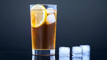 Refreshing iced tea with lemon slices and ice cubes in a glass against a dark background photo