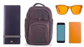 Stylish backpack and accessories arranged on a plain background for lifestyle and travel themes photo