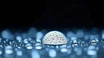 Close-up of water droplets on a smooth surface, creating a serene atmosphere with reflections photo