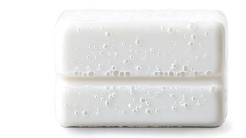 Close-up of a pristine white soap bar with bubbles, highlighting cleanliness and freshness photo