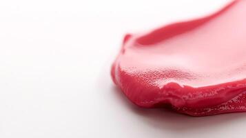 Close-up of vibrant pink paint smeared on a white surface, showcasing smooth texture and shine photo
