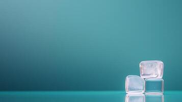 Three ice cubes stacked on a reflective surface against a soft teal background, evoking freshness photo