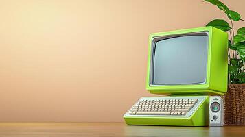 Vintage green computer on a wooden desk with a plant in the background, creating a retro vibe photo