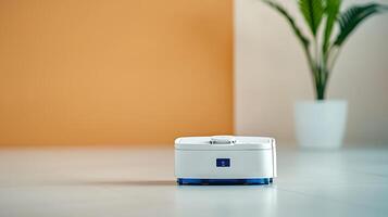 Modern robotic vacuum cleaner on a sleek floor with a minimalist background and greenery photo