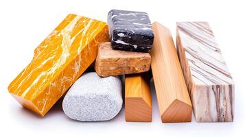 Various types of decorative stones and blocks arranged artistically on a white background photo