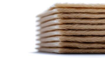 Soft, stacked fabric layers in a minimalist setting, showcasing texture and depth against a white background photo